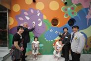 Officiating Guests performed the eye-dotting of dinosaurs on mural painting at the opening ceremony of the Manulife Children's Resources Centre