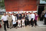 Guests gathered for a group photo in front of the new Centre