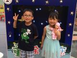 Children pose for a photo after visiting the exhibition.